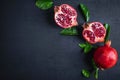 Pomegranate fruit sliced Ã¢â¬â¹Ã¢â¬â¹on a black background